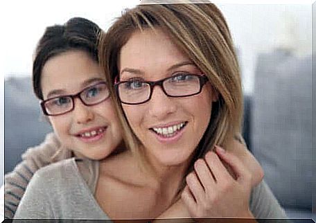 Mother and son with glasses.