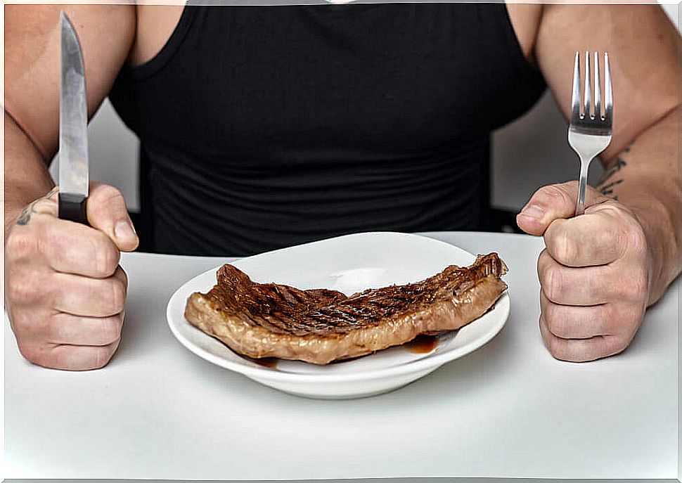 Man eating steak