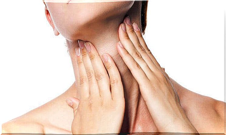 Woman with hands on her neck