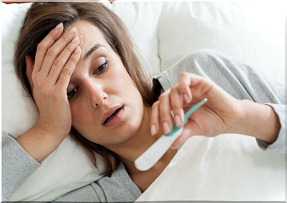 Q fever, woman in bed with thermometer