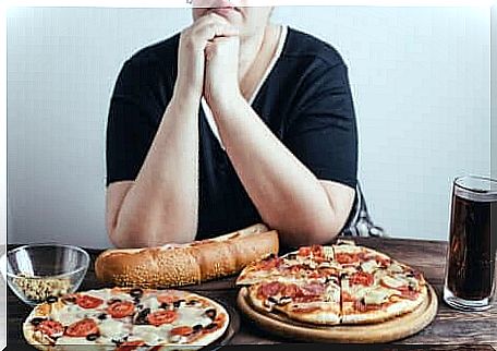 Lady eating pizza.