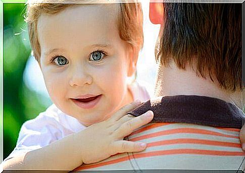 Baby in her arms smiling