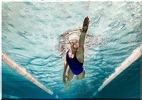 Woman practicing swimming.