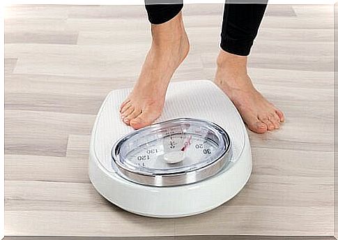 Woman on weighing scale