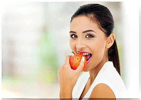 Woman eating an apple