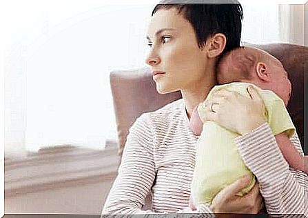 Mom with newborn in her arms.