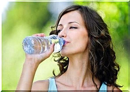 Woman drinking water.