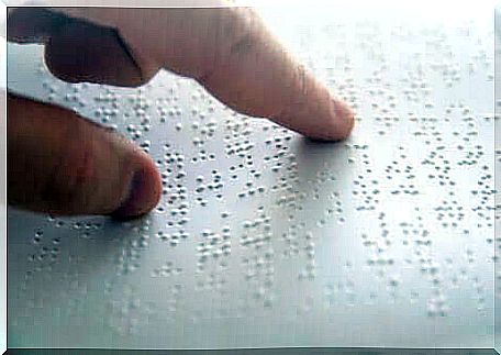 Reading a text in Braille.