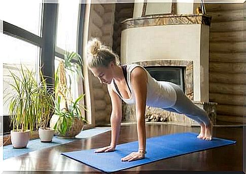 Girl doing push-ups in a workout to burn calories