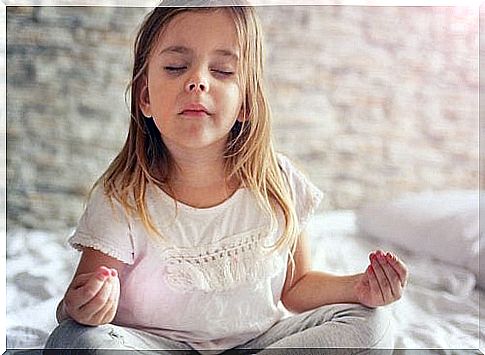 Little girl practicing yoga